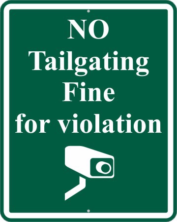 A green sign with an image of a camera.