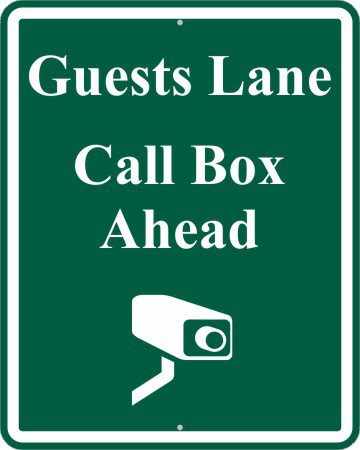 A sign that says guests lane, call box ahead.